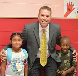 Ayda Lopez Vasquez and Xaviyon Stovall get a picture with Superintendent, Bart Flener!